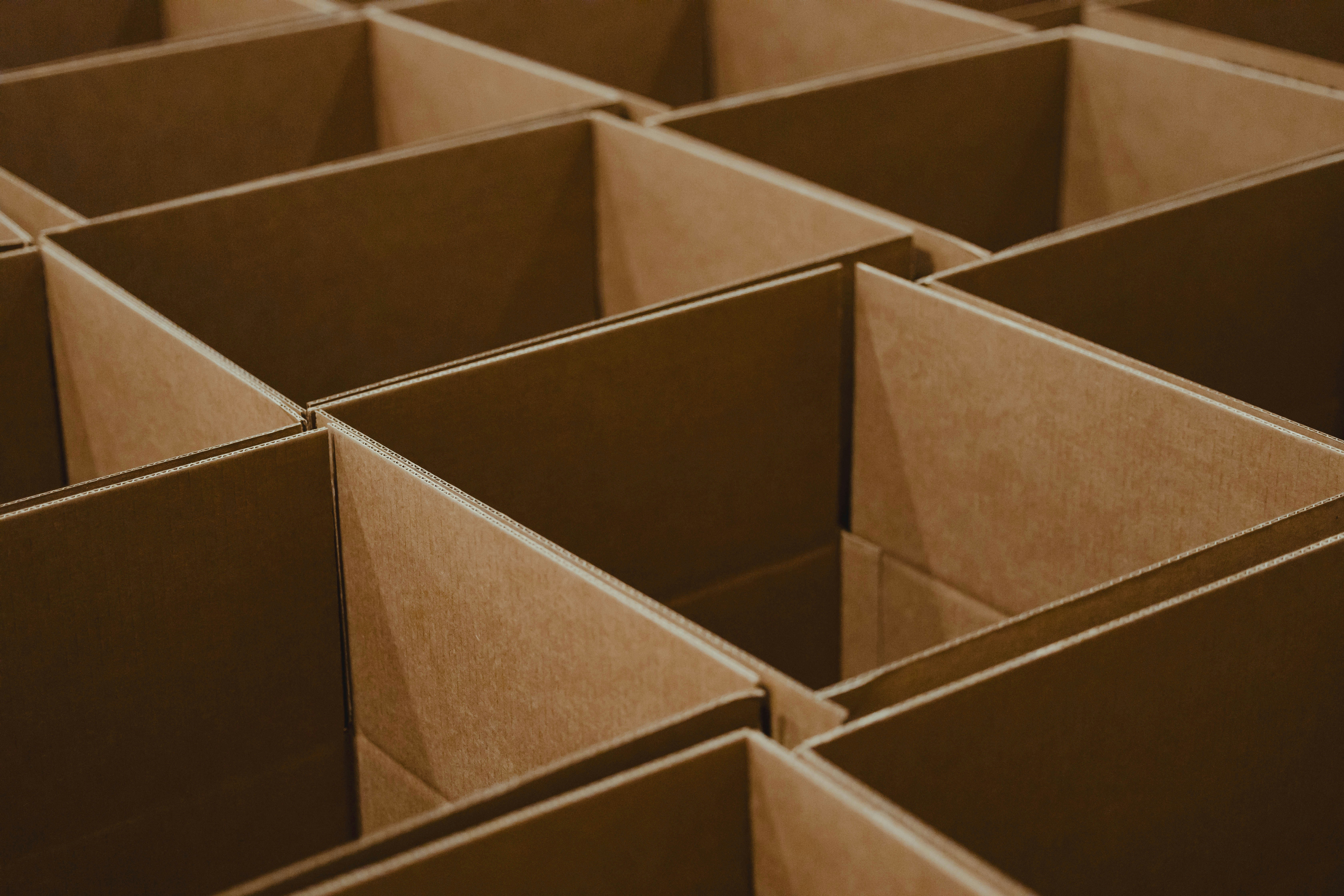 Open brown cardboard boxes placed side by side